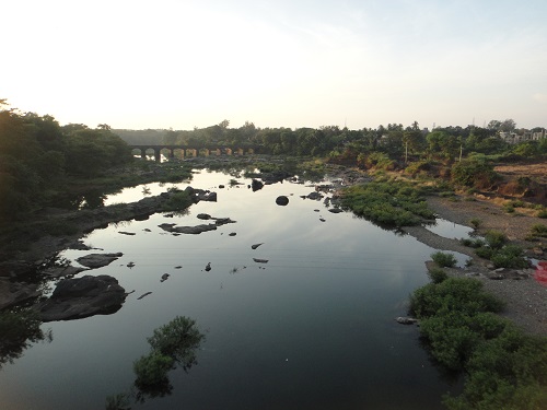 Distant bridge over river, stream